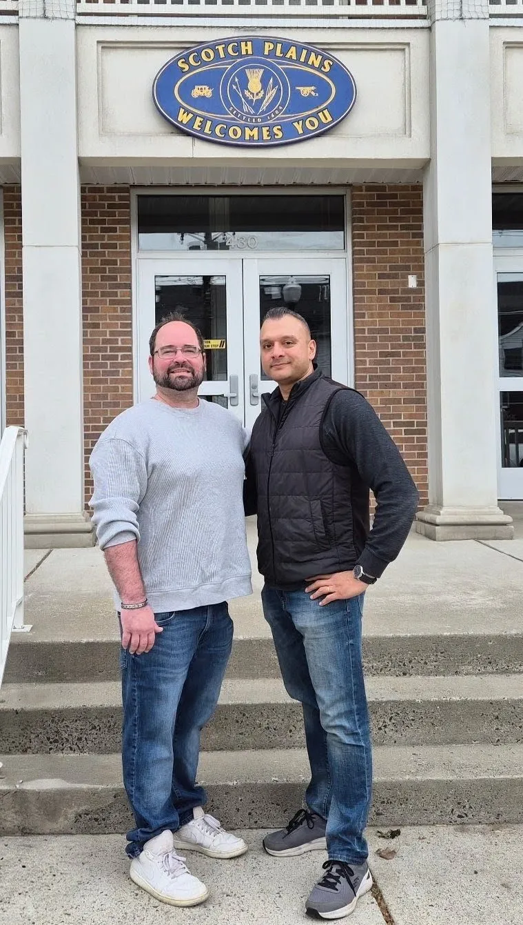 Romel D'Munda with running mate Brian Johdos outside a Scotch Plains municipal building